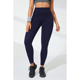 Babe Beachwaer black high waisted leggings worn with black sneakers and gray sports top