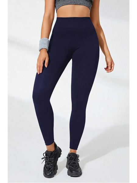 Babe Beachwaer black high waisted leggings worn with black sneakers and gray sports top