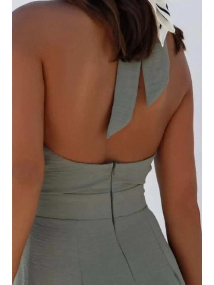 Back view of Babe Beachwear halter neck wide leg jumpsuit in gray with bow tie detail