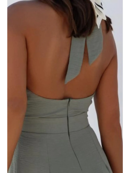 Back view of Babe Beachwear halter neck wide leg jumpsuit in gray with bow tie detail