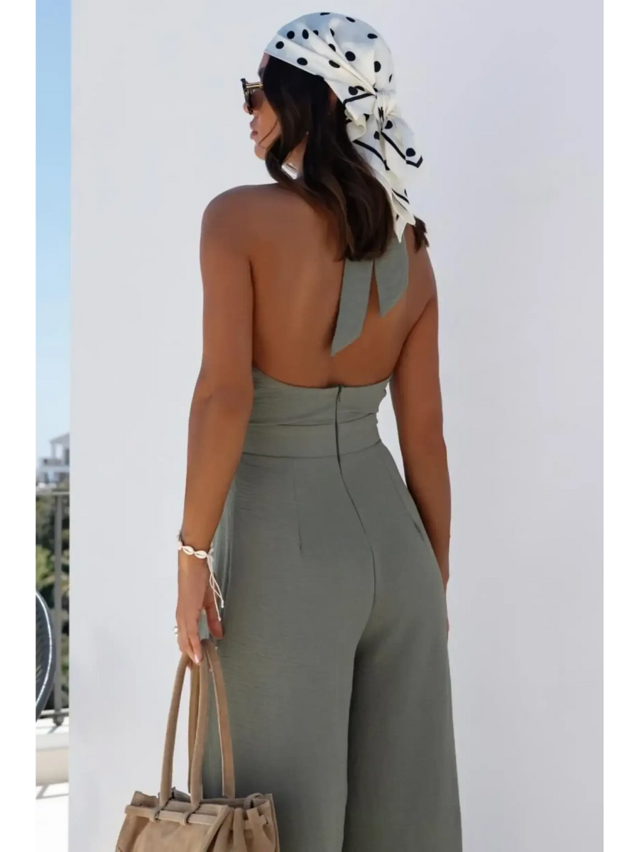 Back view of Babe Beachwaer's halter neck wide leg jumpsuit in olive green with open back and high waist