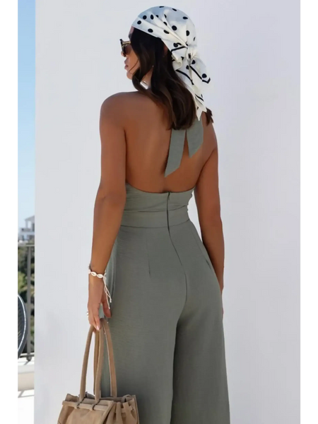Back view of Babe Beachwaer's halter neck wide leg jumpsuit in olive green with open back and high waist
