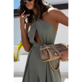 Babe Beachwear halter neck wide leg jumpsuit in olive green with a stylish belt and tan clutch bag