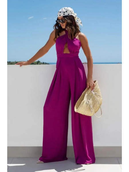 Babe Beachwear halter neck wide leg jumpsuit in bright purple worn with a scarf and sunglasses