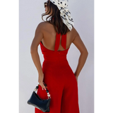 Babe Beachwaer halter neck wide leg jumpsuit in red with open back and accessories
