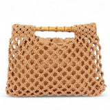 Artini Accessories crochet bamboo handle clutch in tan with intricate woven design and bamboo handles