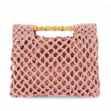 Artini Accessories crochet bamboo handle clutch in pink with open weave design and bamboo handles