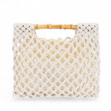 Artini Accessories crochet bamboo handle clutch in cream with open weave design and bamboo handles