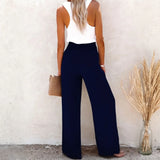 Babe Beachwaer high waisted beach pants set in navy blue worn with white sleeveless top