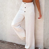 Babe Beachwear high waisted beach pants set in white with button details and wide leg design