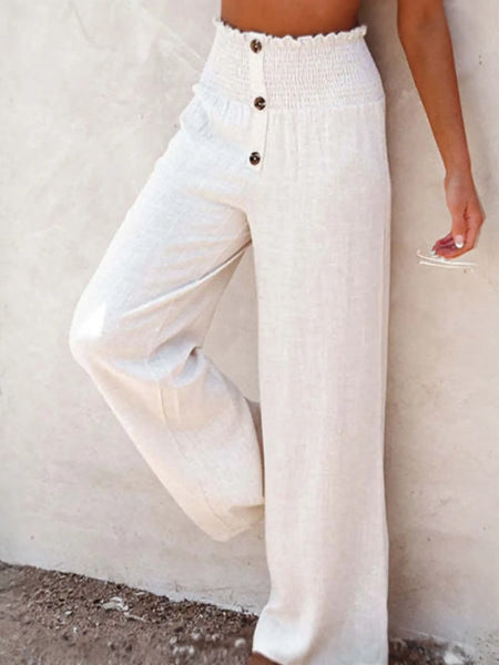 Babe Beachwear high waisted beach pants set in white with button details and wide leg design