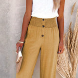 Babe Beachwear high waisted beach pants set in tan with button details and wide leg fit