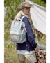 Woman wearing Himawari - Best Backpack by Babe Beachwaer in light blue outdoors with hiking gear