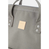 Close-up of Babe Beachwear himawari durable backpack in gray with stitched handles and logo patch
