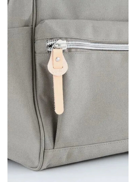 Close-up of gray himawari durable backpack with silver zipper and beige leather pull tab