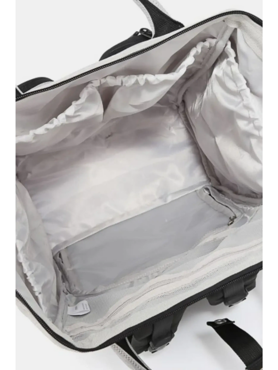 Interior view of large capacity waterproof back pack Himawari by Babe Beachwaer showing multiple storage compartments
