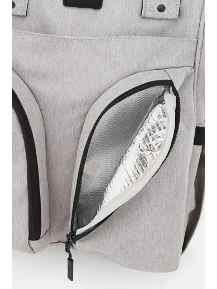 Close-up of beige large capacity waterproof back pack Himawari by Babe Beachwaer showing insulated zippered pocket