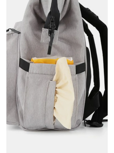 Gray Babe Beachwaer large capacity waterproof back pack Himawari with side pocket holding a yellow and beige item