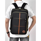 Himawari Lightweight Carry-On Backpack by Babe Beachwaer in black with brown accents worn by person