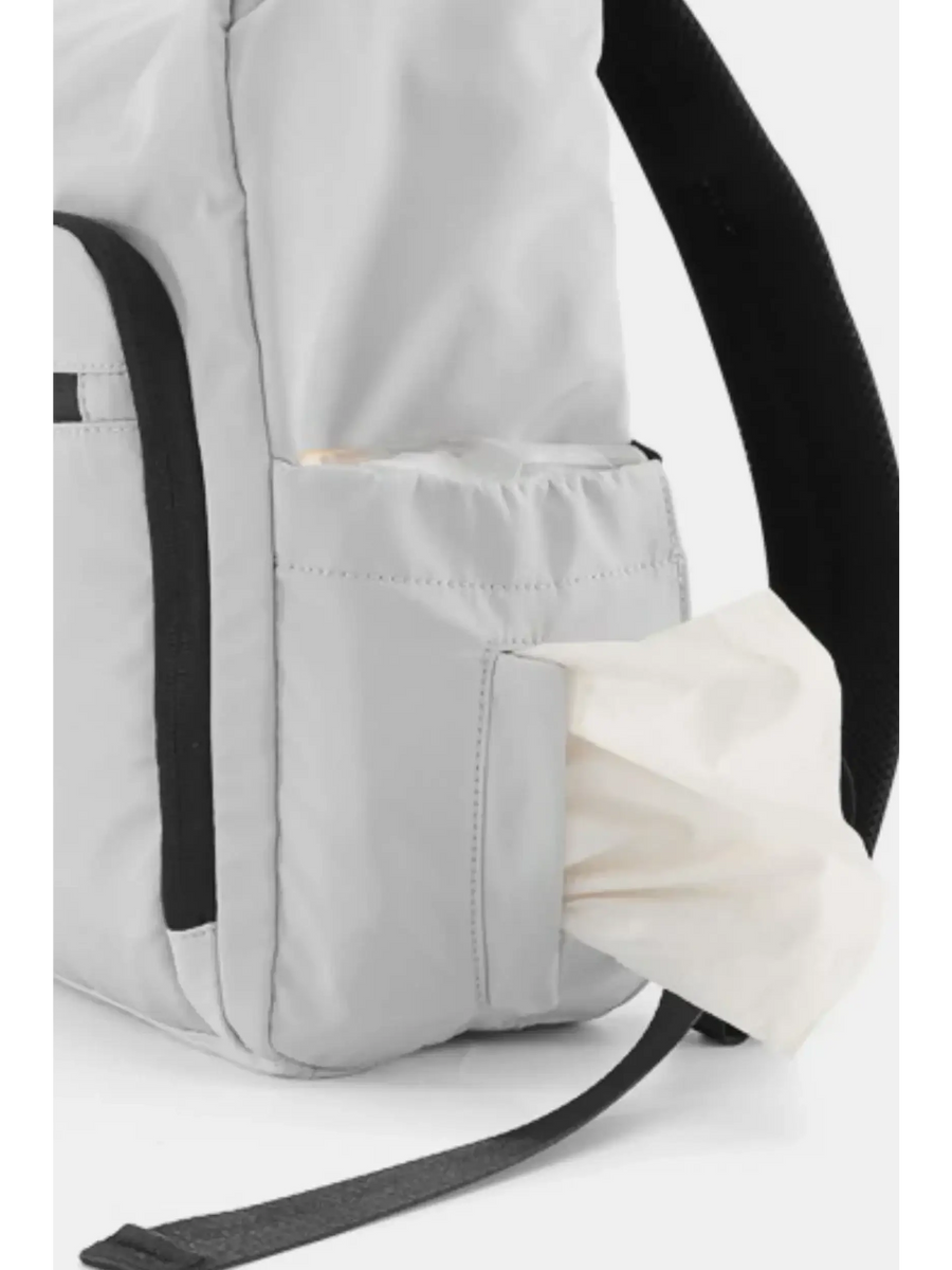 Close-up of Babe Beachwaer Himawari Nylon Top-Open Backpack side pocket with tissue dispenser and black strap