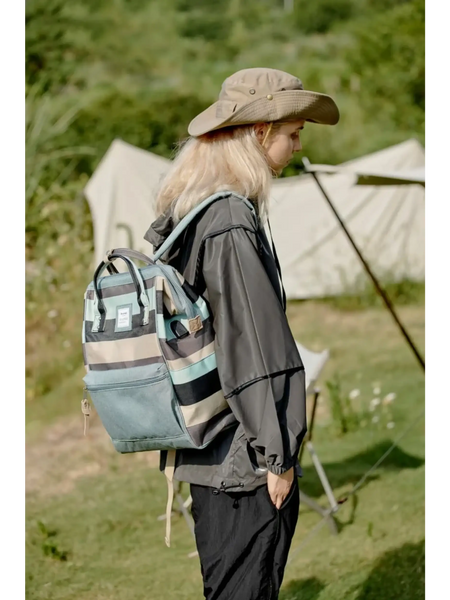 Himwari Large waterproof backpack by Babe Beachwear striped design worn by person outdoors