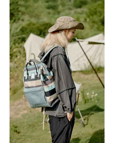 Himwari Large waterproof backpack by Babe Beachwear striped design worn by person outdoors