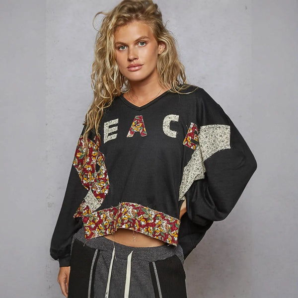 Black cropped sweatshirt with floral patches from Rock the Bloom collection