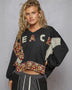 Black cropped sweatshirt with floral patches from Rock the Bloom collection