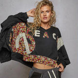 Black cropped sweatshirt with floral peace sign from Rock the Bloom collection