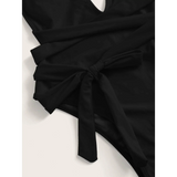 Trendsi black swimsuit close up showing side tie detail for Hot Pink halter one piece
