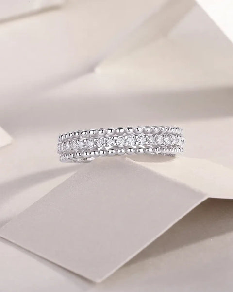 Babe Beachwear infinity Moissanite band ring with sparkling stones and silver beaded edges