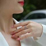 Babe Beachwear infinity Moissanite band ring worn on finger showcasing its sparkling design and elegance