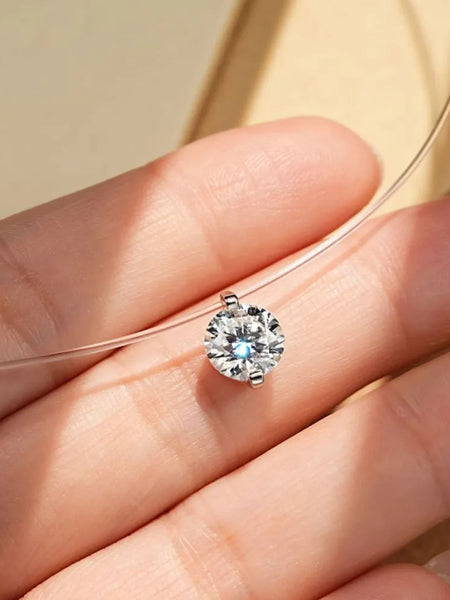 Trendsi necklace featuring an invisable 1 carat diamond on a clear wire chain