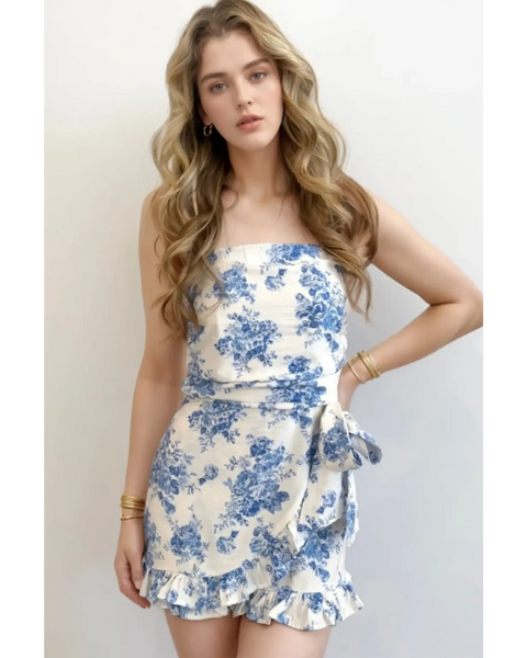 Trendsi junior size strapless ruffle hem romper in white with blue floral print and side bow tie