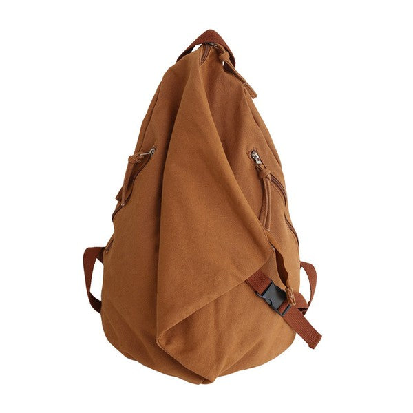 Brown Kai Asymetric Canvas Backpack by Babe Beachwaer with multiple zippered pockets and adjustable straps