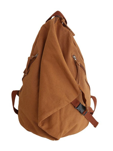 Brown Kai Asymetric Canvas Backpack by Babe Beachwaer with multiple zippered pockets and adjustable straps