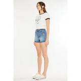Trendsi kancan button fly cutoff shorts in blue denim worn with white graphic tee and sneakers