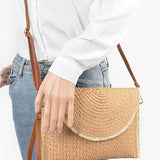 Babe Beachwear khaki convertible straw purse worn crossbody with adjustable brown strap