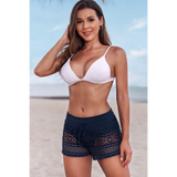 Trendsi women's beach cover up shorts in navy blue crochet design worn on the beach