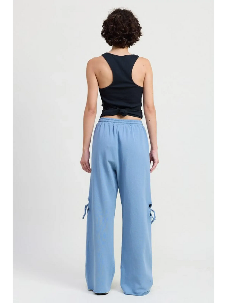 Emory Park laser cutout cotton beach pants wide leg in light blue worn by model from back