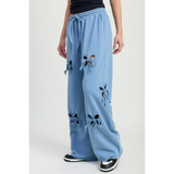 Emory Park wide leg laser cutout cotton beach pants in light blue with bow details and drawstring waist
