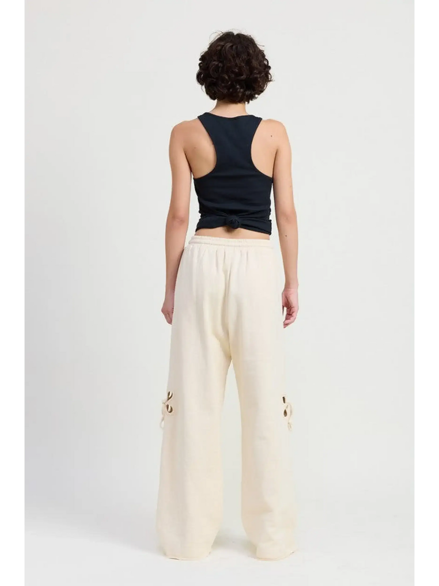 Emory Park wide leg laser cutout cotton beach pants in cream worn with a black tank top