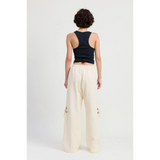 Emory Park wide leg laser cutout cotton beach pants in cream worn with a black tank top