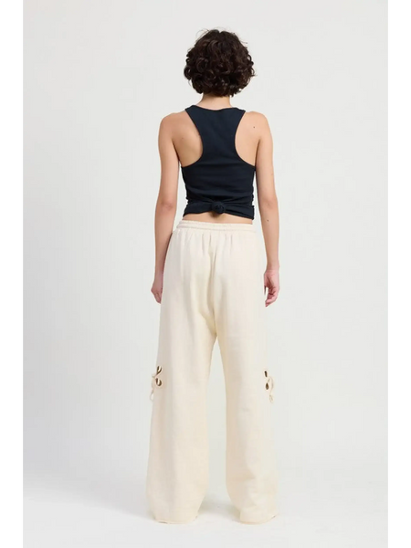 Emory Park wide leg laser cutout cotton beach pants in cream worn with a black tank top