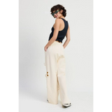Emory Park wide leg laser cutout cotton beach pants in cream worn by model with black tank top