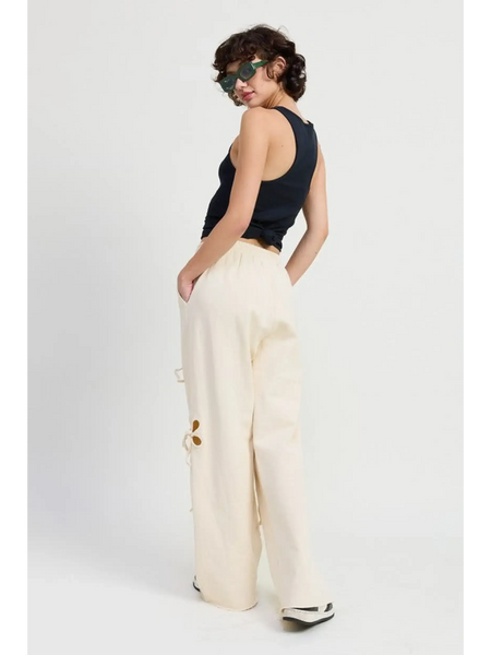 Emory Park wide leg laser cutout cotton beach pants in cream worn by model with black tank top