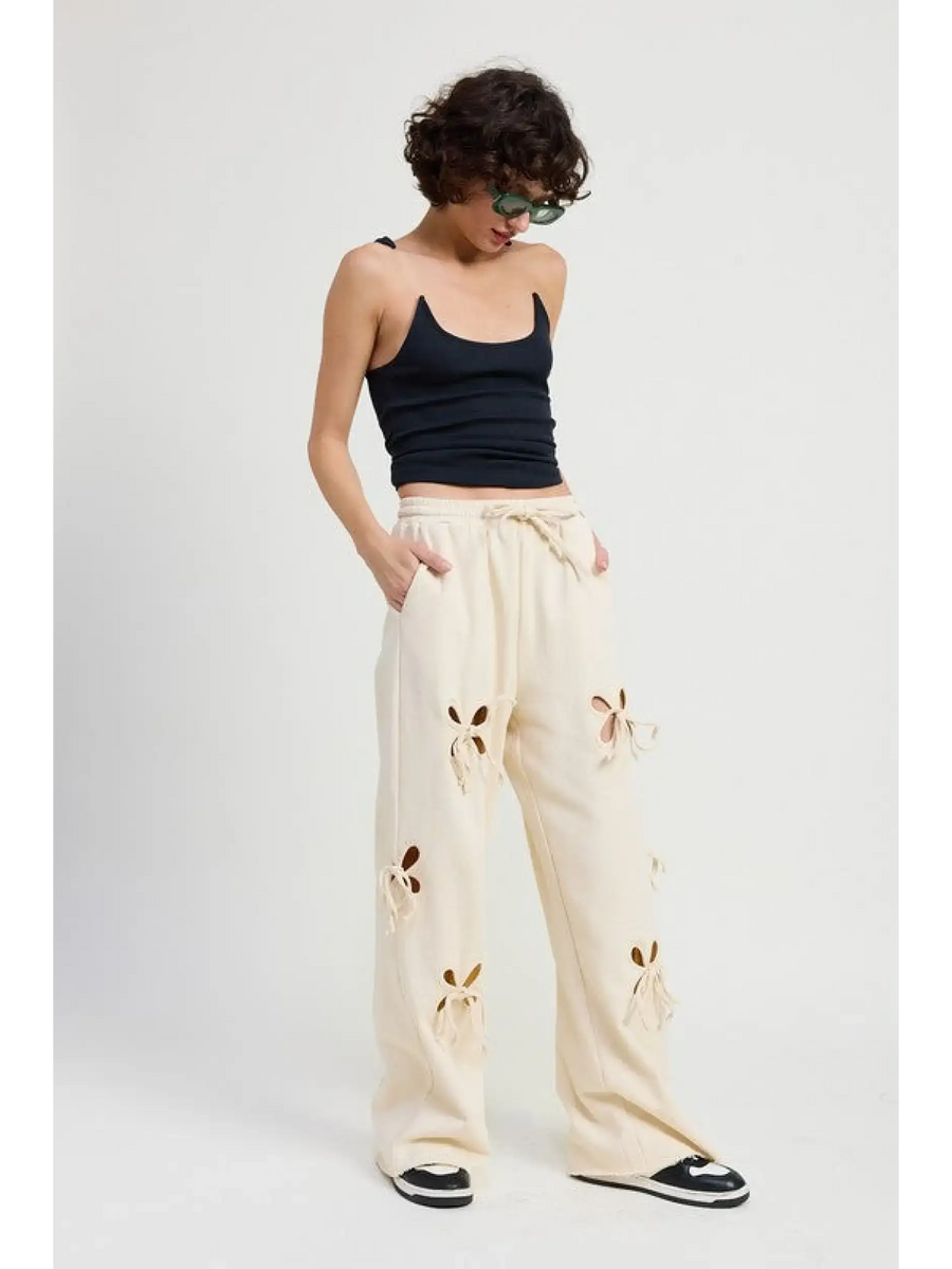 Emory Park wide leg laser cutout cotton beach pants in cream styled with black tank top and sneakers