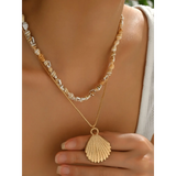 Trendsi Layered Shell Necklace featuring gold shell pendant and natural shell beads on layered chains