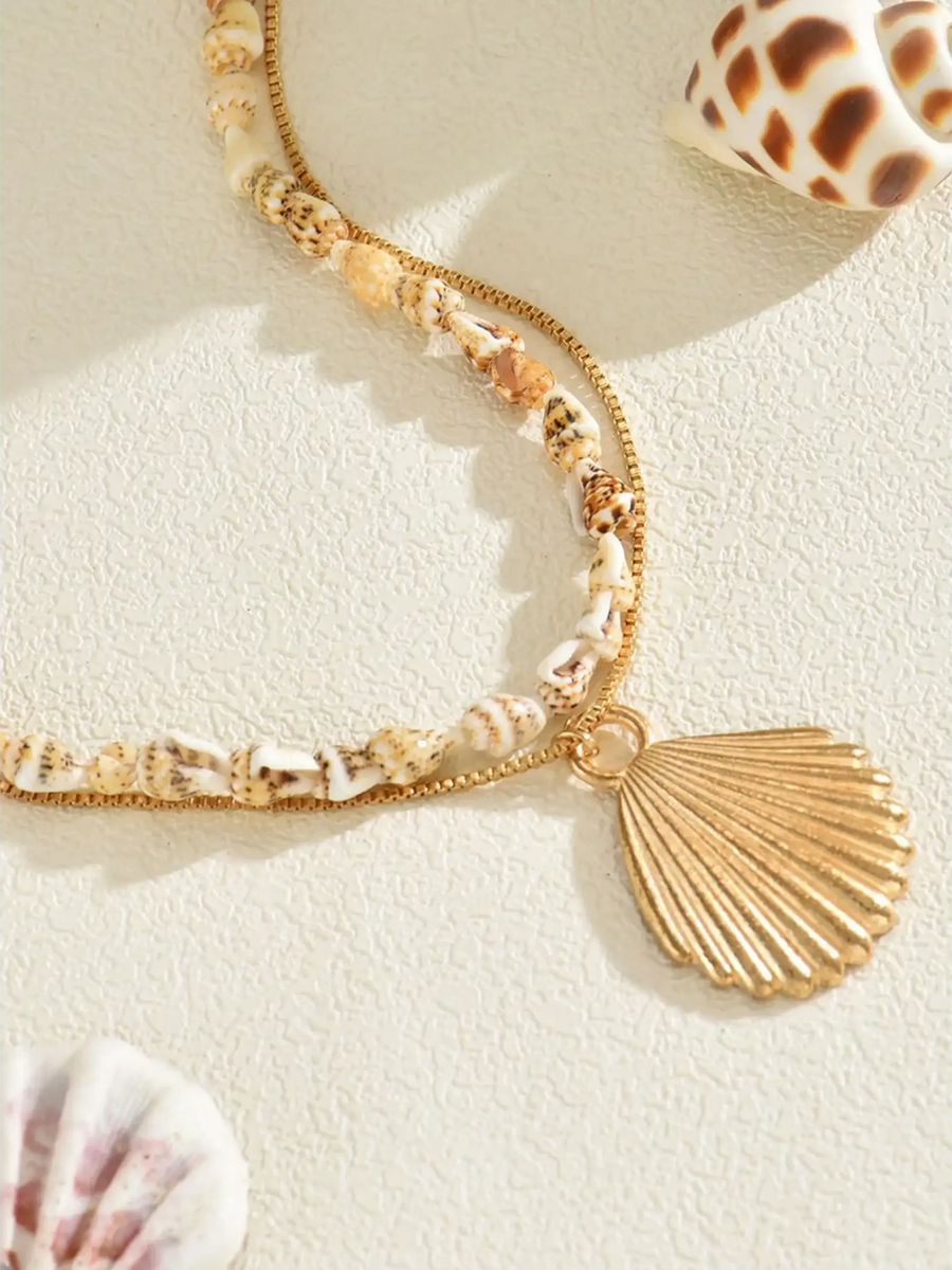 Trendsi Layered Shell Necklace featuring small seashell beads and a gold shell pendant