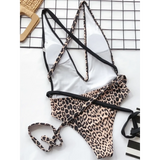 Beach Babes leopard print swimsuit for women with thin adjustable straps and black accents